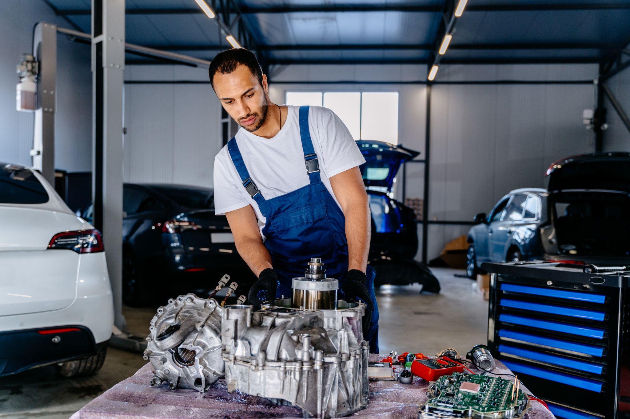 Car engine removed from car for repair.