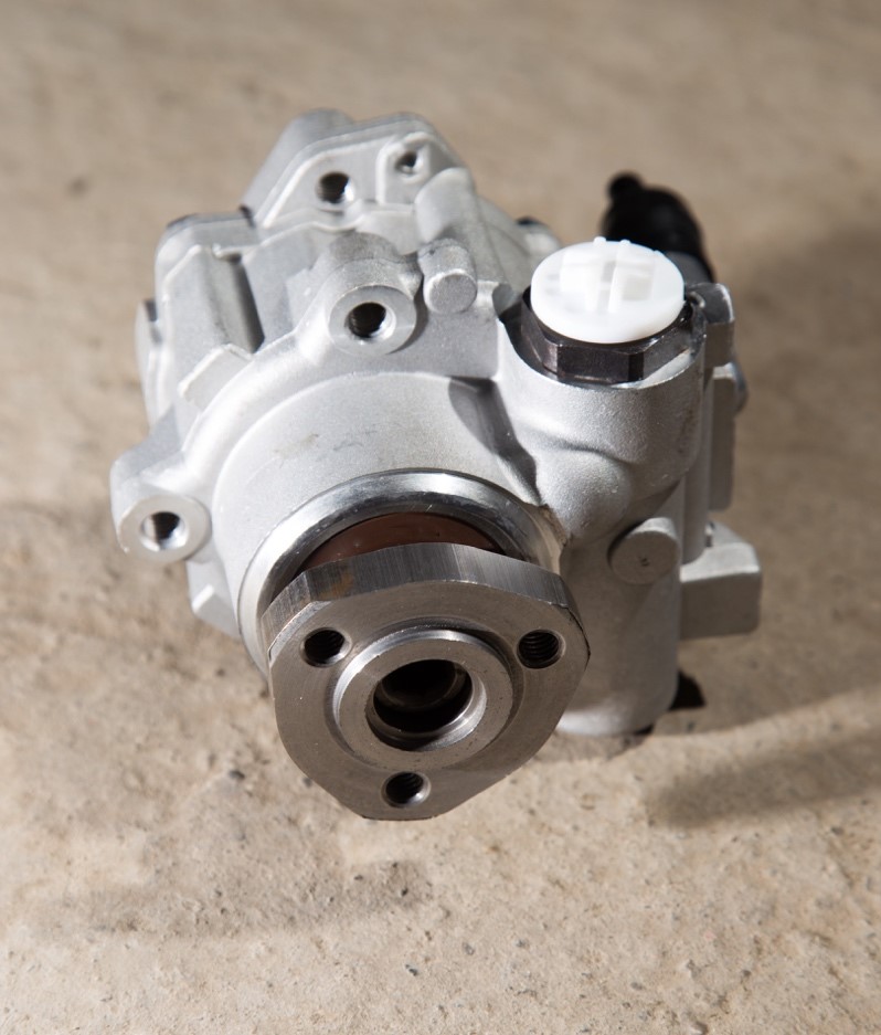 Mechanic taking apart hydraulic machinery